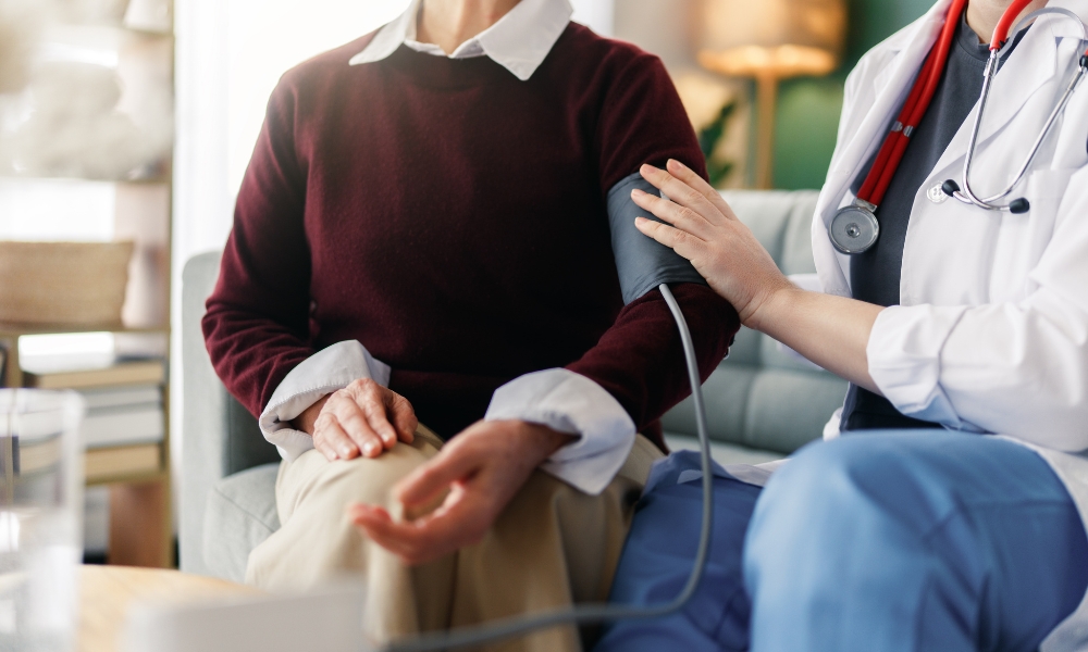 Understanding Blood Pressure Readings in Katy TX Doctor explaining systolic and diastolic blood pressure readings to an adult patient during a primary care visit in Katy TX